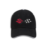 A black baseball cap featuring Corvette C3 crossed flags embroidered on the front, one red and one black-and-white checkered, with a white piping accent along the curved brim.