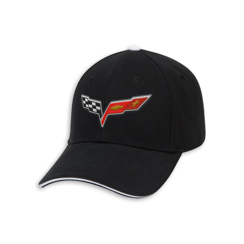 A black baseball cap featuring an embroidered Corvette C6 logo on the front, with a checkered flag motif and a red chevron. The cap has a white piping accent along the edge of the curved brim, set against a plain white background.